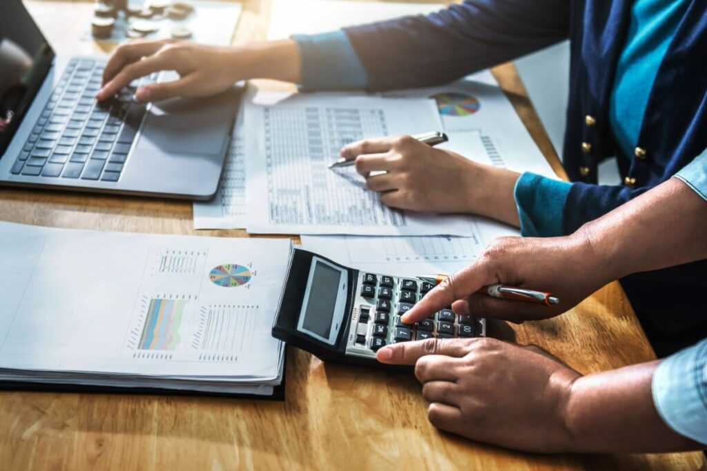 Accountancy team looking at tax report and bookkeeping.