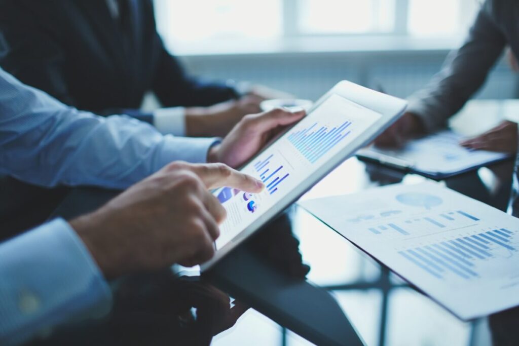 Man working on finances and bookkeeping on a tablet computer.