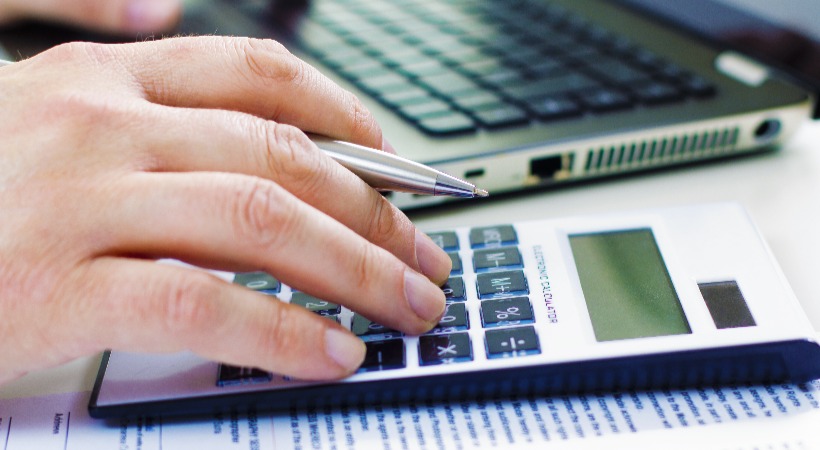 Person working on VAT calculations