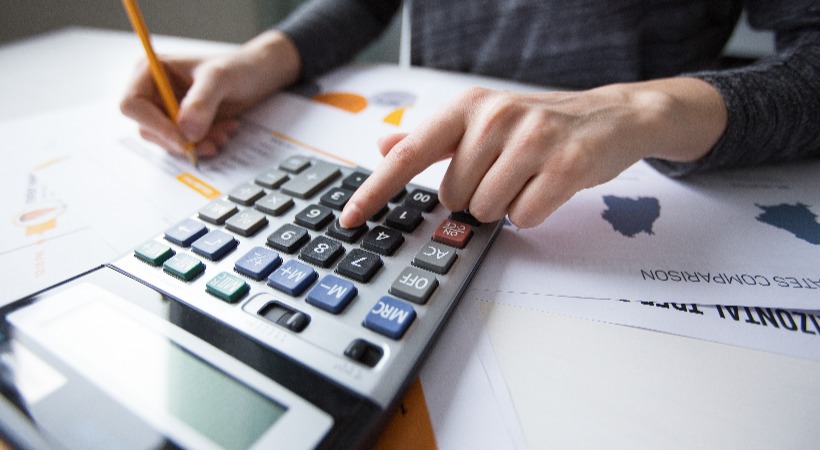 Person working on VAT calculations.