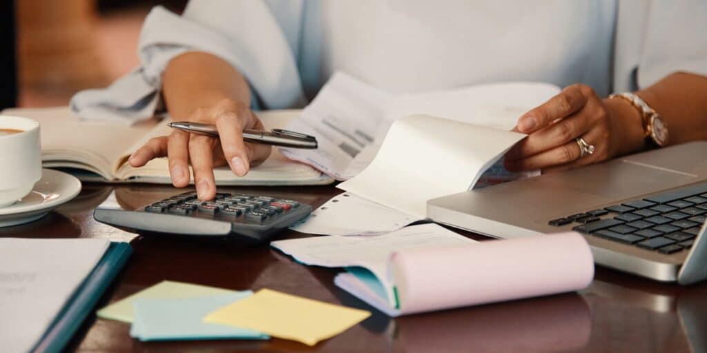 Entrepreneur working with bills.