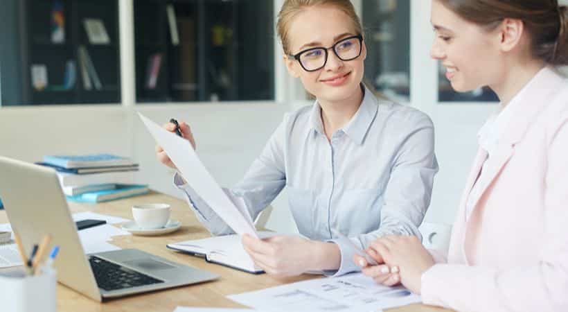 business owner meeting with an accountant to register for VAT
